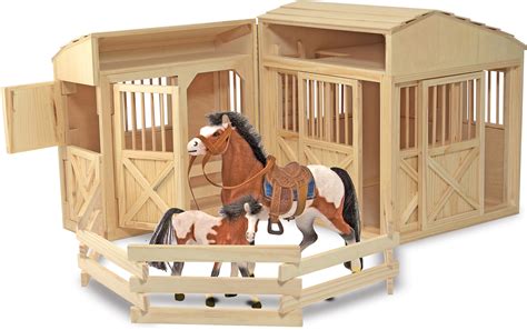 Each stall has a gate with hook and staple closure. . Toy horse barn